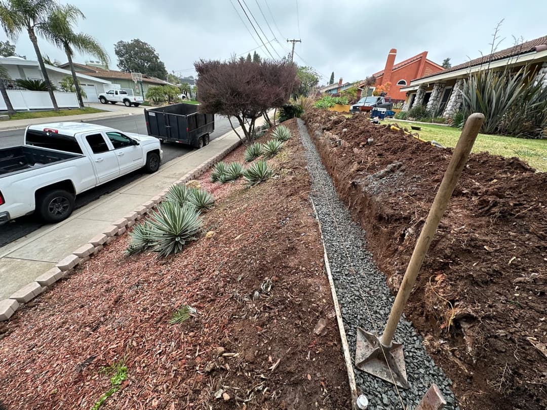 Landscape renovation in progress with new planter borders and soil preparation